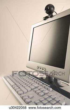 Stock Photo - Computer with webcam attachment. Fotosearch