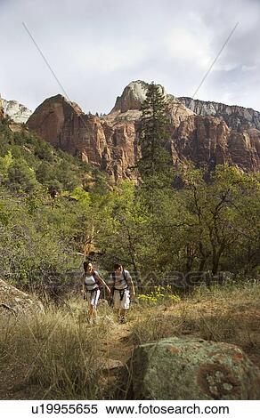 Stock Photography - Couple backpacking. Fotosearch