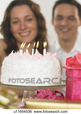 Stock Photograph - Couple celebrating her birthday. Fotosearch