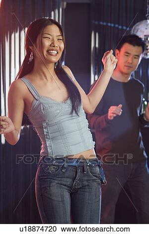Couple dancing in a nightclub View Large Photo Image Stock Image - Couple dancing in a nightclub. Fotosearch