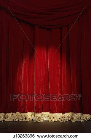 Stock Photograph - Curtain with spotlight. Fotosearch