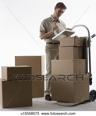 Stock Image - Delivery man with packages. Fotosearch