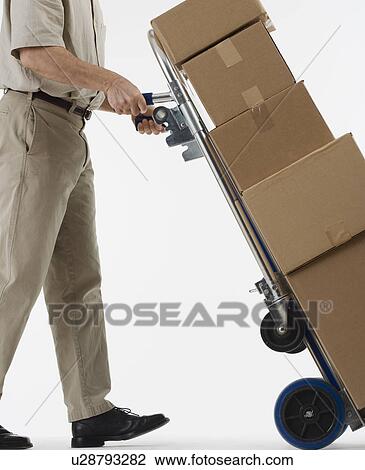 Stock Image - Delivery man with packages. Fotosearch