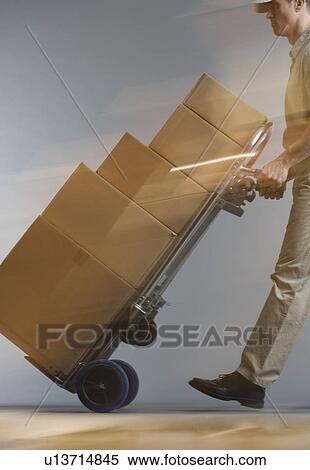 Stock Photography - Delivery man with packages. Fotosearch