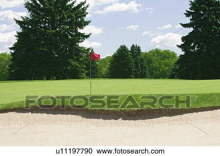 Stock Image - Detail of golf course sand trap. Fotosearch