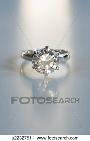 Diamond like ring in six pronged silver setting on table View Large Photo Image Stock Image - Diamond like ring in six pronged silver setting on table. Fotosearch
