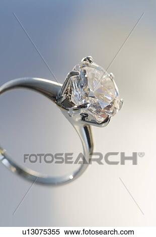 Stock Photography - Diamond like ring in six pronged silver setting. Fotosearch