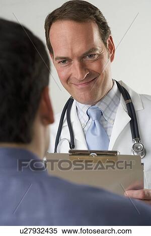 Stock Photography - Doctor meeting with patient. Fotosearch