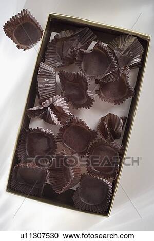 Stock Image - Empty candy box with wrappers. Fotosearch