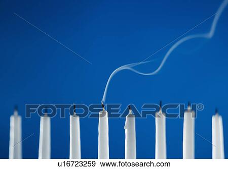 Extinguished candles in a menorah View Large Photo Image Stock Photo - Extinguished candles in a menorah. Fotosearch