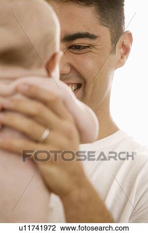Father holding baby View Large Photo Image Stock Image - Father holding baby. Fotosearch