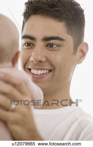 Father holding baby View Large Photo Image Stock Photography - Father holding baby. Fotosearch