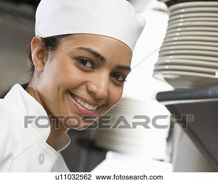 Female chef in restaurant kitchen View Large Photo Image Stock Image - Female chef in restaurant kitchen. Fotosearch