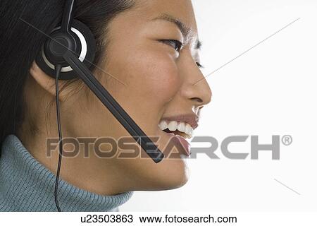 Stock Image - Female customer service representative. Fotosearch