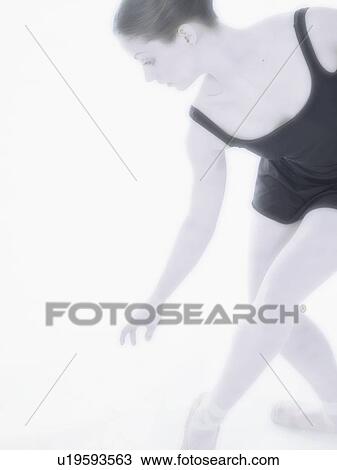 Female dancer reaching down View Large Photo Image Stock Image - Female dancer reaching down. Fotosearch