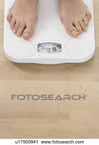 Female feet on bathroom scale View Large Photo Image Stock Image - Female feet on bathroom scale. Fotosearch