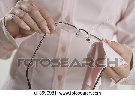 Female hands cleaning eyeglasses View Large Photo Image Stock Image - Female hands cleaning eyeglasses. Fotosearch
