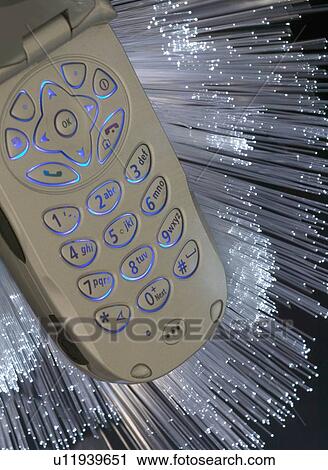Stock Image - Fiber Optics with mobile phone. Fotosearch