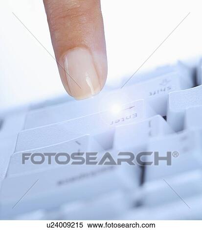 Finger pushing enter key on computer View Large Photo Image Stock Photography - Finger pushing enter key on computer. Fotosearch