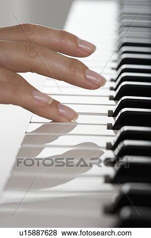 Fingers playing piano View Large Photo Image Stock Photo - Fingers playing piano. Fotosearch