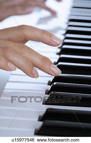 Fingers playing piano View Large Photo Image Stock Photograph - Fingers playing piano. Fotosearch