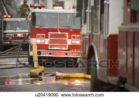 Firetrucks parked with hoses View Large Photo Image Stock Image - Firetrucks parked with hoses. Fotosearch