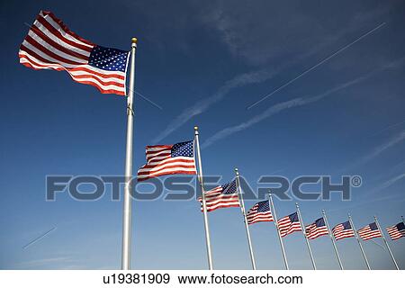 Stock Photo - Flags around Washington Memorial Washington DC USA. Fotosearch