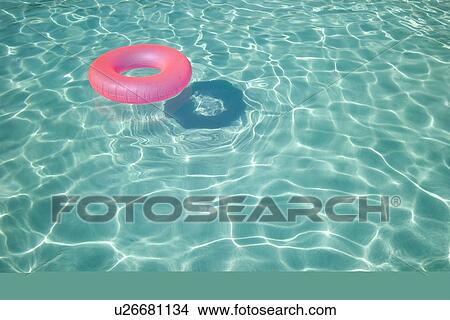 Floatation device in a swimming pool View Large Photo Image Picture - Floatation device in a swimming pool. Fotosearch