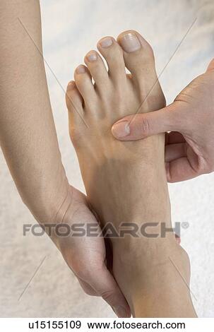 Foot being massaged View Large Photo Image Stock Photo - Foot being massaged. Fotosearch
