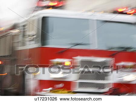 Stock Photograph - Front of fire engine in motion. Fotosearch