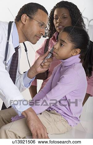 Girl getting check up from pediatrician View Large Photo Image Stock Photograph - Girl getting check up from pediatrician. Fotosearch
