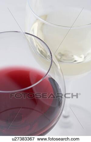 Stock Photo - Glasses of white and red wine. Fotosearch