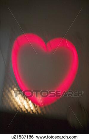 Stock Photograph - Glowing pink heart. Fotosearch