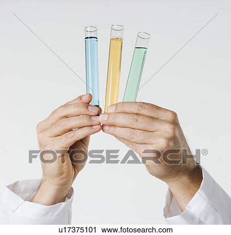 Hand holding test tubes View Large Photo Image Stock Image - Hand holding test tubes. Fotosearch