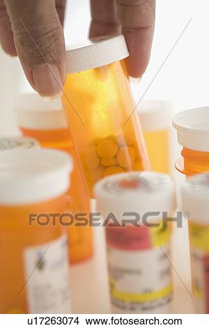 Hand selecting prescription drugs View Large Photo Image Picture - Hand selecting prescription drugs. Fotosearch