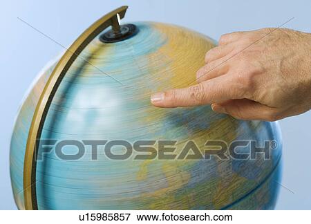 Hand spinning globe View Large Photo Image Stock Photo - Hand spinning globe. Fotosearch