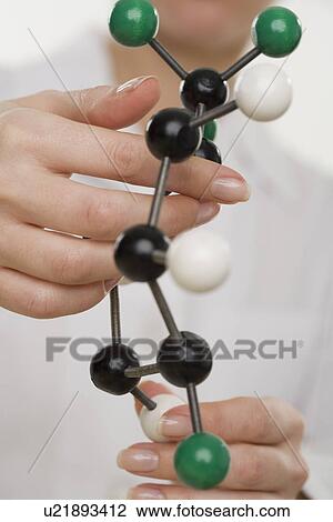 Hands holding molecular model View Large Photo Image Stock Image - Hands holding molecular model. Fotosearch