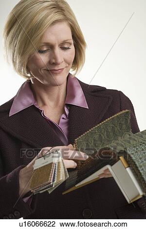 Stock Image - Interior designer at work. Fotosearch