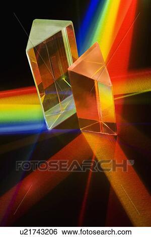 Stock Photograph - Light passing through two prisms. Fotosearch