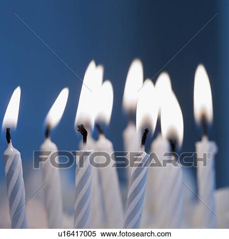 Stock Photography - Lit birthday candles. Fotosearch