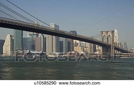 Stock Image - Lower New York and Brooklyn Bridge New York NY. Fotosearch