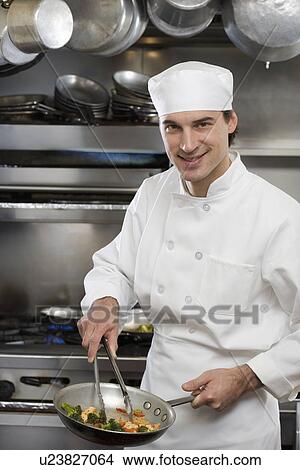 Picture - Male chef in restaurant kitchen. Fotosearch