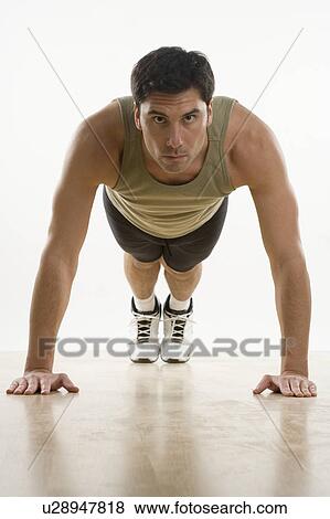 Stock Photo - Man doing pushups. Fotosearch