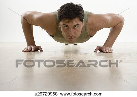 Stock Photo - Man doing pushups. Fotosearch