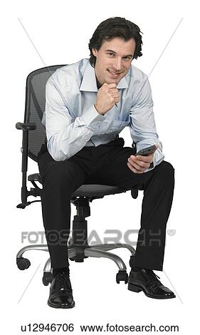 Man holding a PDA View Large Photo Image Stock Photograph - Man holding a PDA. Fotosearch