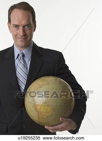 Stock Photography - Man holding globe. Fotosearch