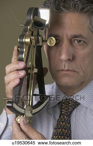 Man holding octant View Large Photo Image Stock Photography - Man holding octant. Fotosearch
