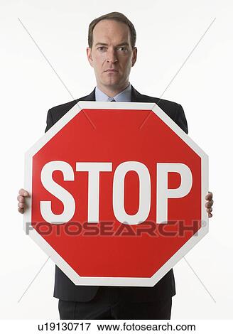 Man holding stop sign View Large Photo Image Stock Photo - Man holding stop sign. Fotosearch