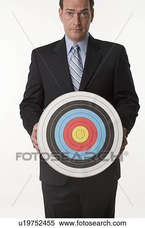 Man holding target View Large Photo Image Stock Photography - Man holding target. Fotosearch