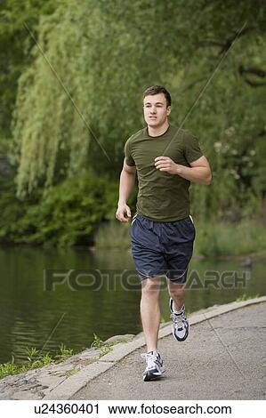 Man jogging in park View Large Photo Image Stock Image - Man jogging in park. Fotosearch